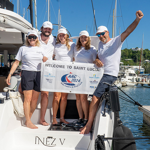 The crew of Inez V celebrating arriving in Saint Lucia after ARC 2024