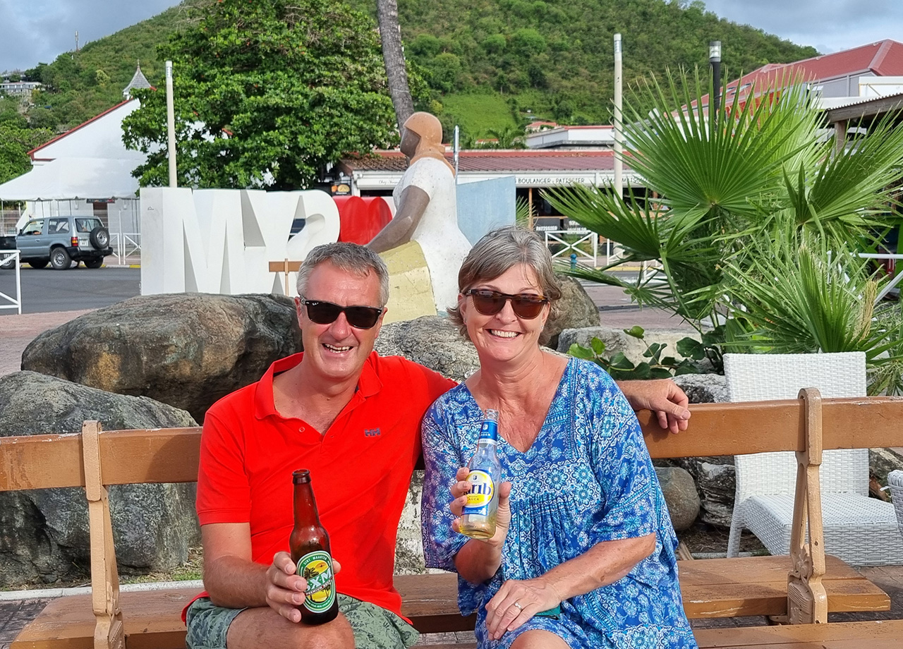 A man and woman from yacht Pirates Moon enjoy the SMX Tourism part on the beach in ARC Europe 2025
