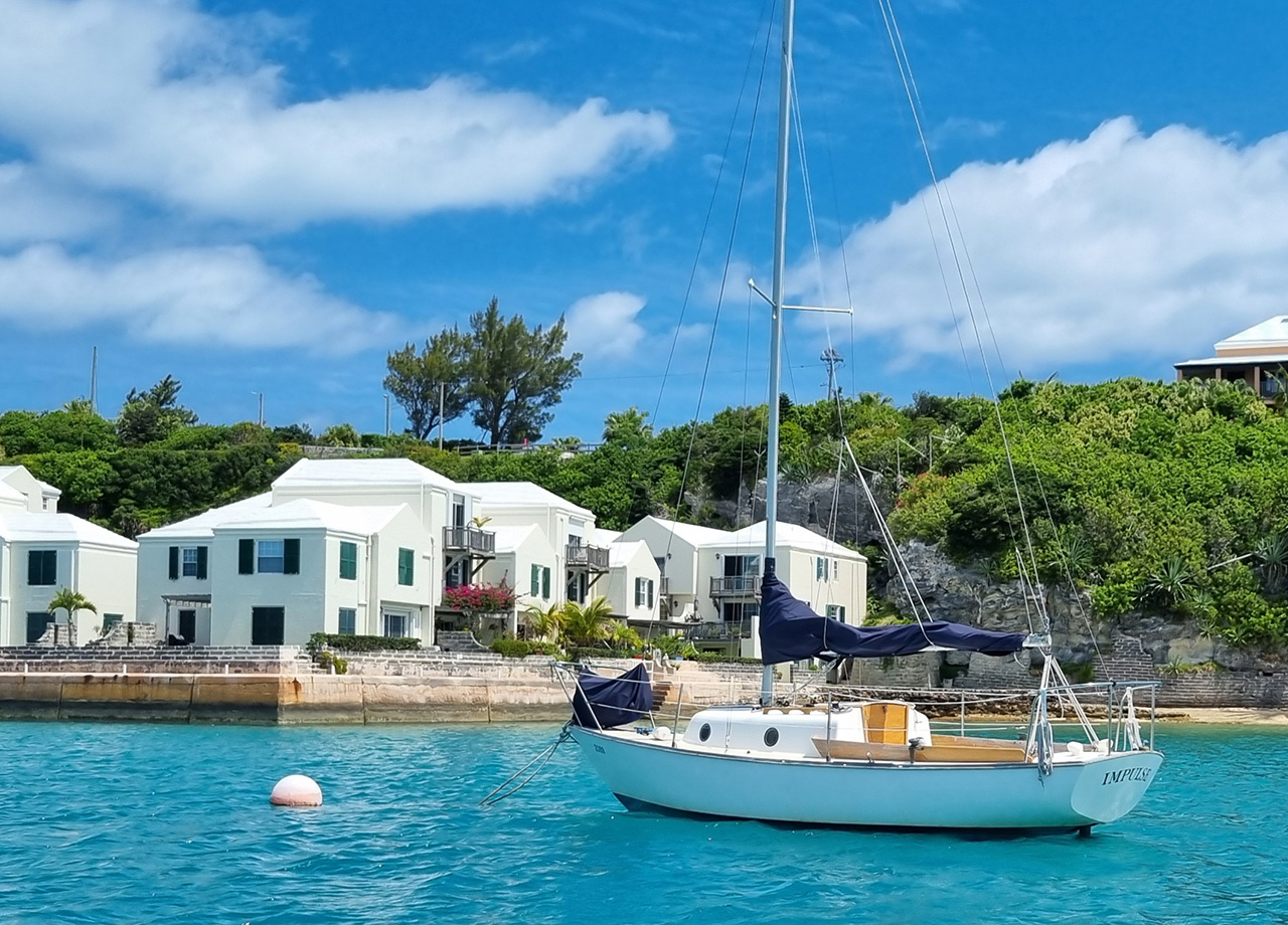 A small local sailboat moored in the harbour of St Georges, Bermuda one of the destinations of ARC Europe