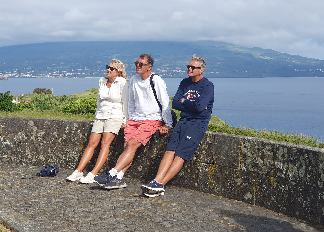 Two men and a woman from yacht Cavatina relax on a tour of Faial, Azores