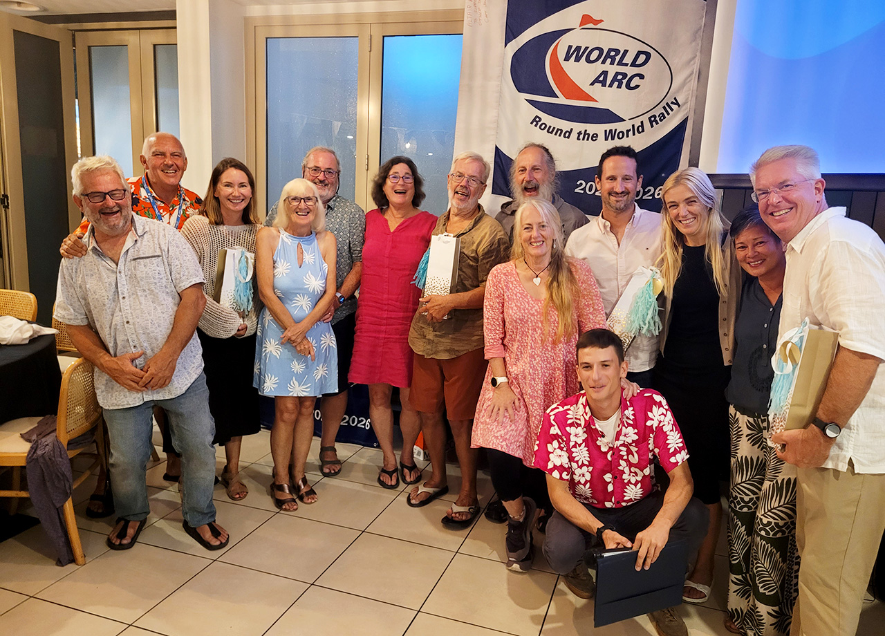 Men and women from yachts Pure Joy, Pelican, Alegria and Imi Ola pose at the World ARC prizegiving in Mackay