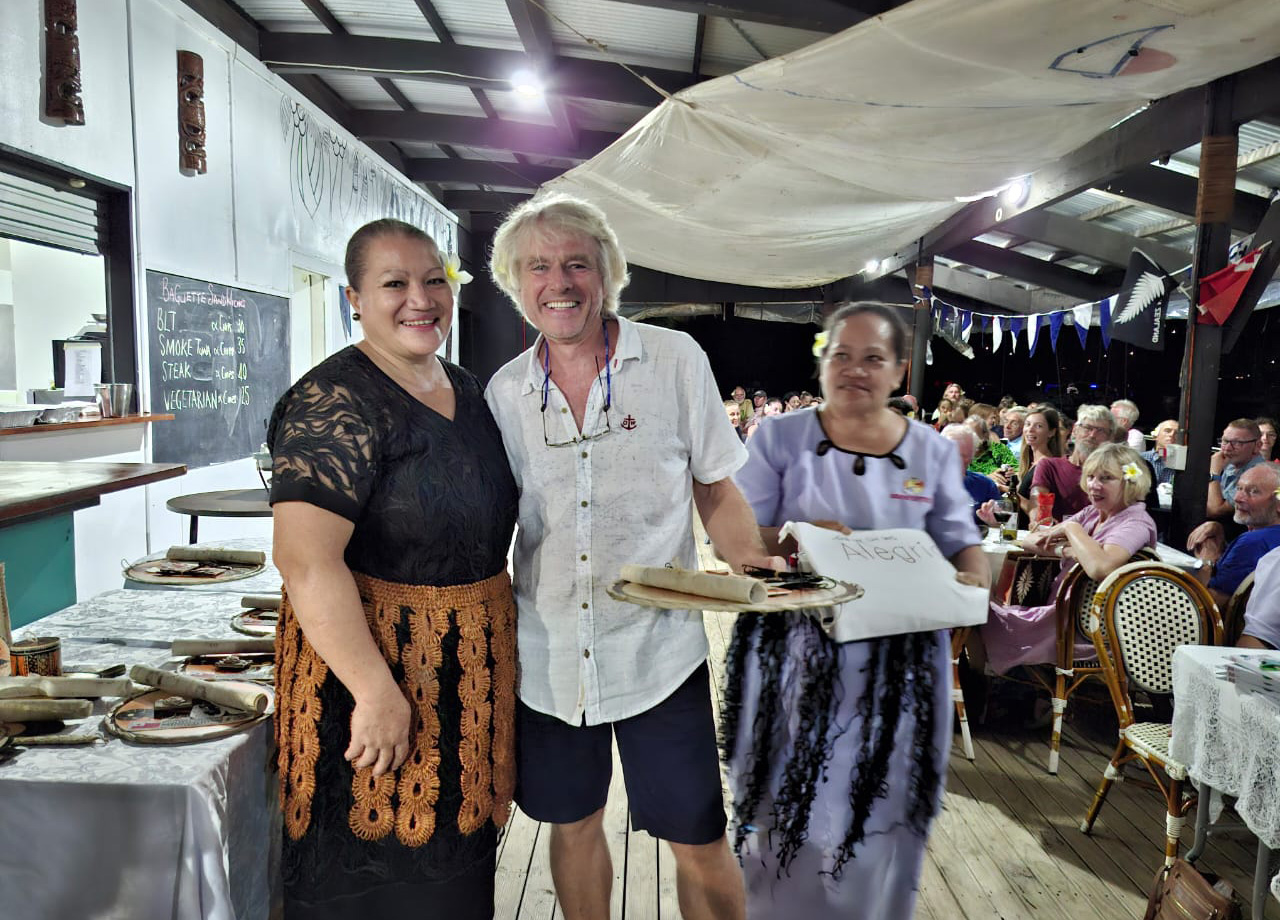 A man poses with a Tongan woman at the World ARC prizegiving dinner in Tonga