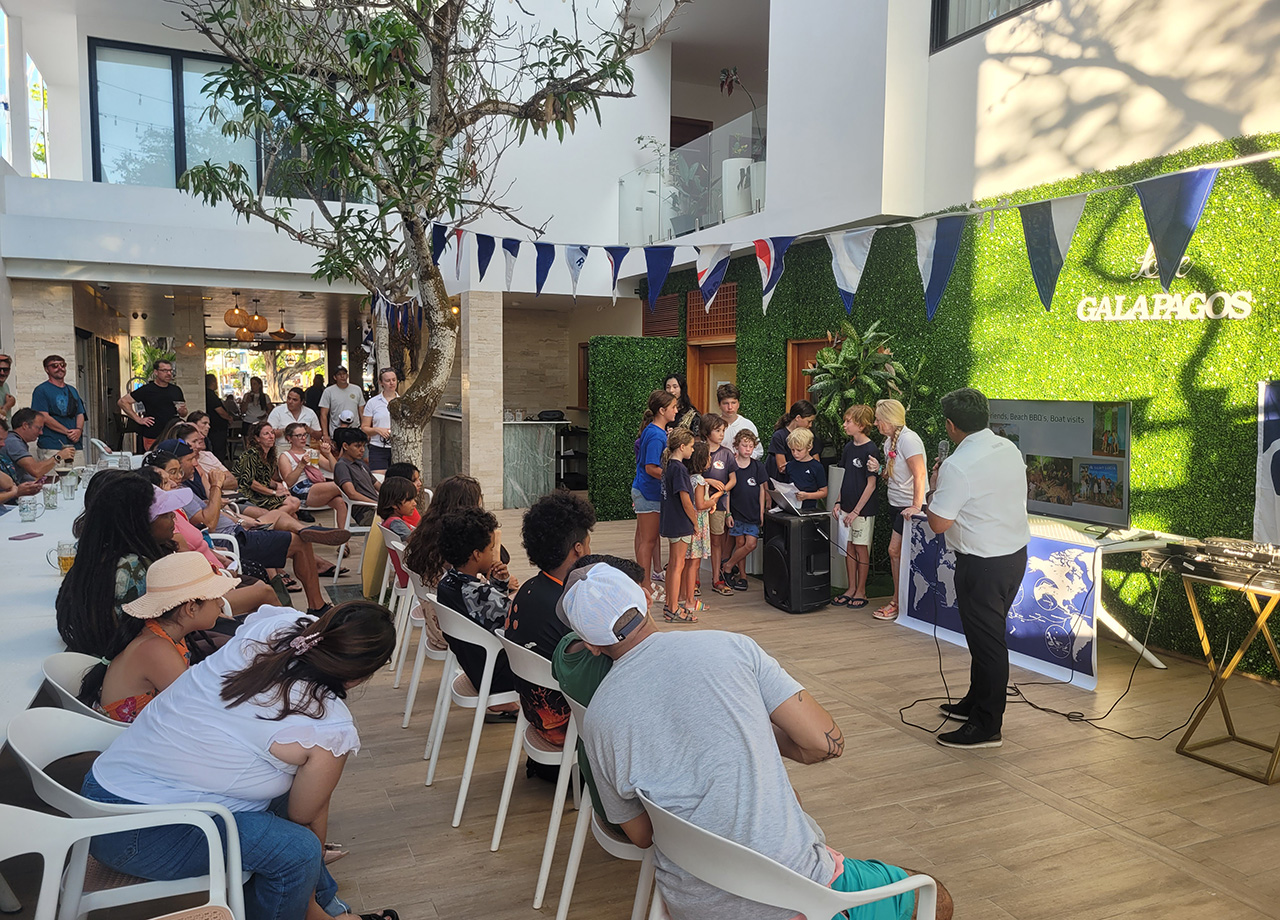 World ARC children and local Galapagos children share stories of their lives at a presentation in cafe Umami