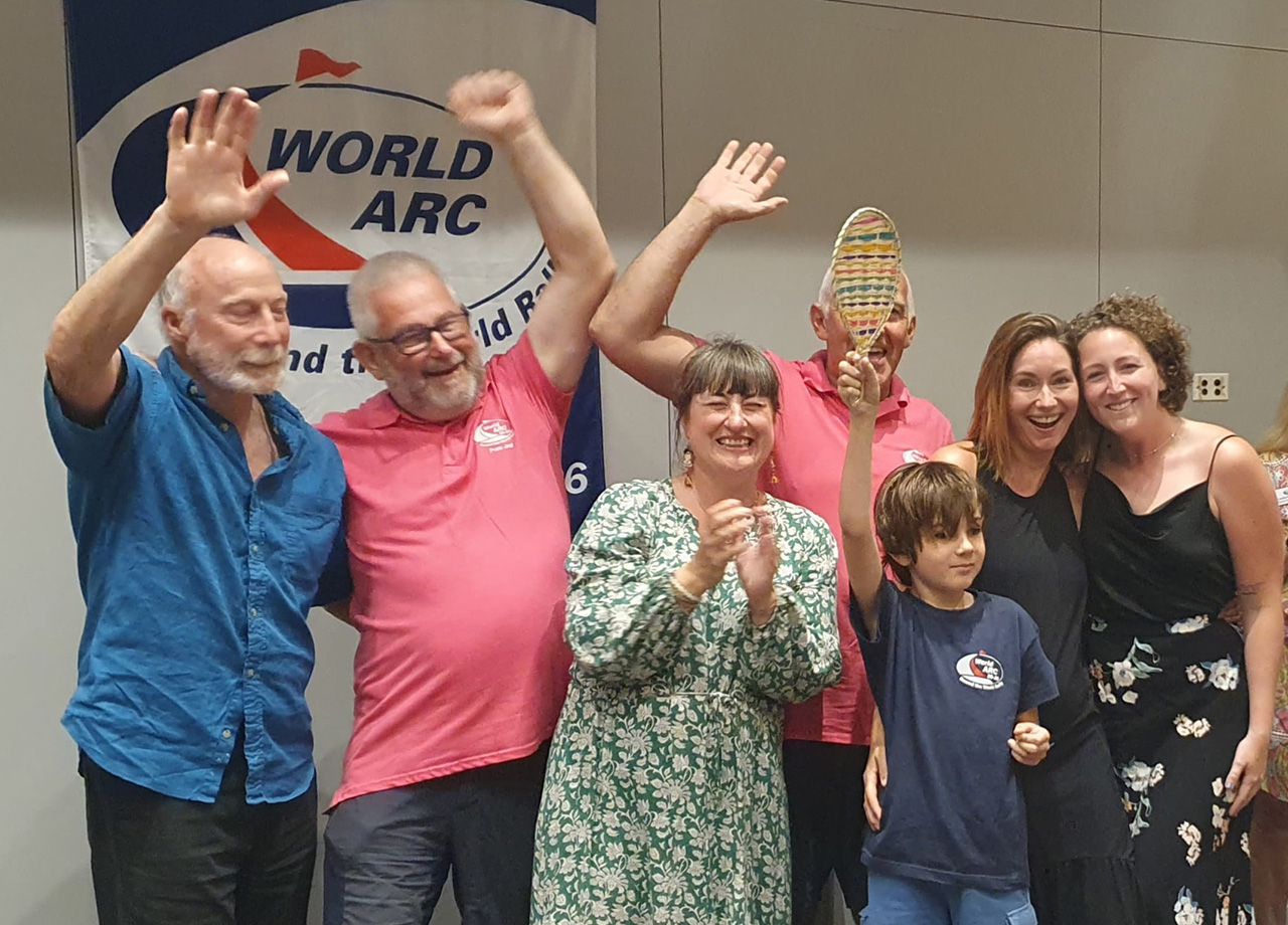 The family crew of yacht Pure Joy accepting a prize in Colombia on World ARC 2025-26
