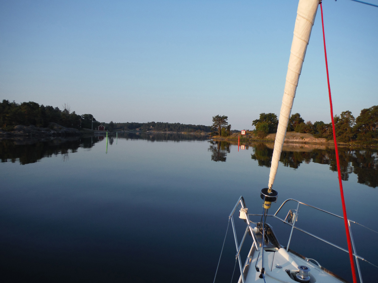 A tranquil evening on a yacht with the water looking like glass and a clear sky